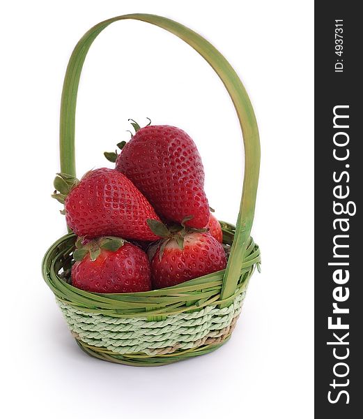 Red, fresh, tasty strawberries in small wicker basket. Red, fresh, tasty strawberries in small wicker basket