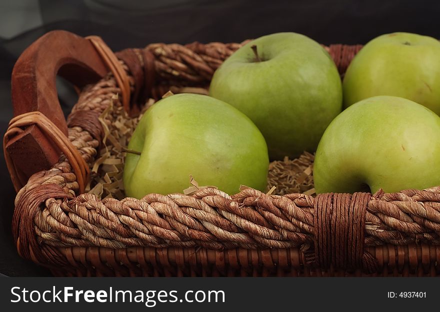 Green, fresh and tasty apples in wicker, nice basket. Green, fresh and tasty apples in wicker, nice basket