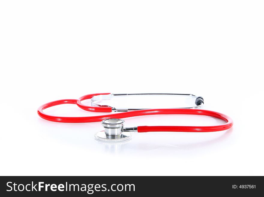 A red stethoscope over white background.
