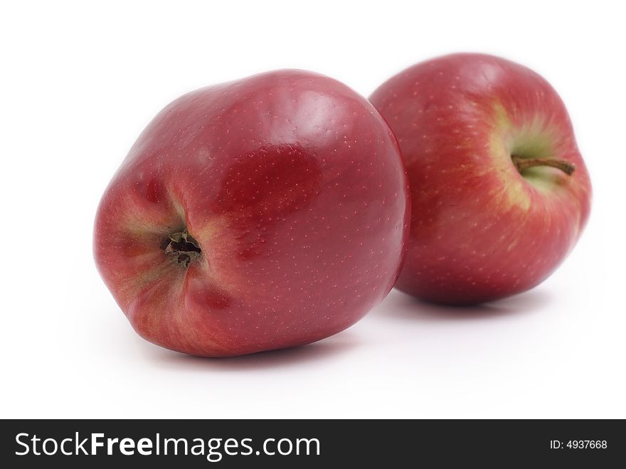 Two red apples on white background, fresh and tasty. Two red apples on white background, fresh and tasty