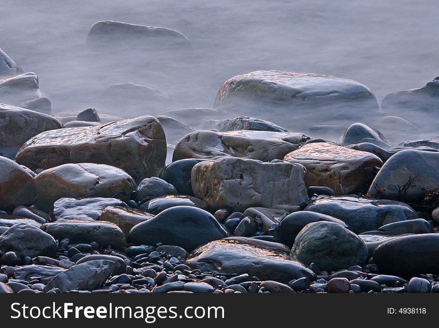 Stones on the atlantic shore after sunset. Stones on the atlantic shore after sunset