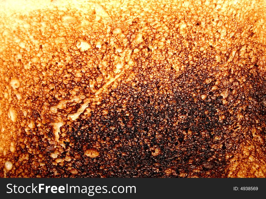 Close up photo of burnt toast texture for use as abstract or background