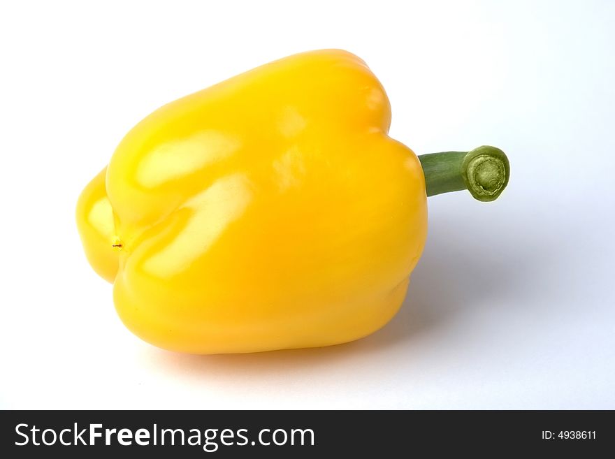 A photo of a fresh yellow paprika. A photo of a fresh yellow paprika