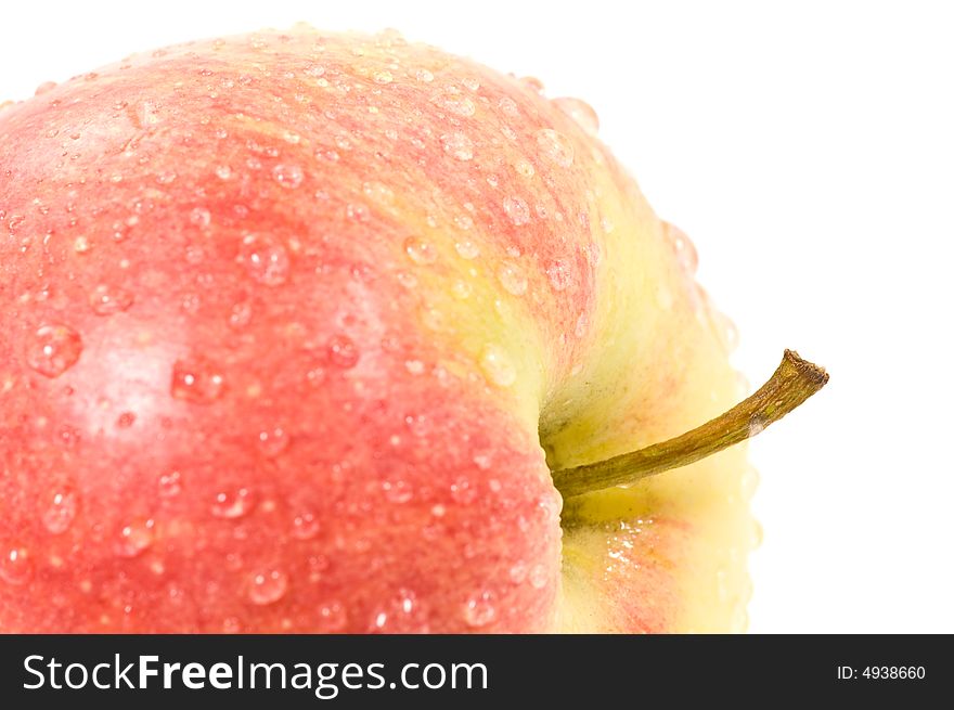 Macro of a fresh apple with waterdrops isolated on white