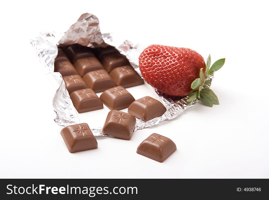 Chocolate bar with a fresh red strawberry. Chocolate bar with a fresh red strawberry