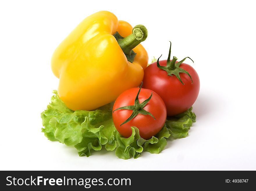 A photo of a fresh paprika and tomato on list of salad. A photo of a fresh paprika and tomato on list of salad