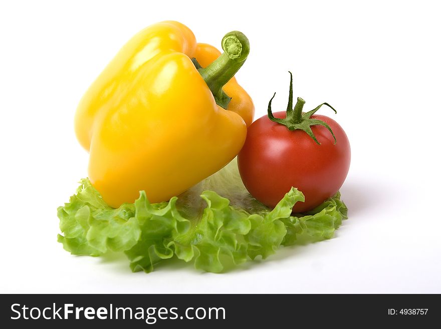 A photo of fresh vegetables - yellow paprika and tomato