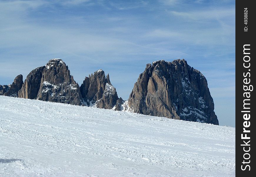 Mount Sassolungo during winter with snow. Mount Sassolungo during winter with snow