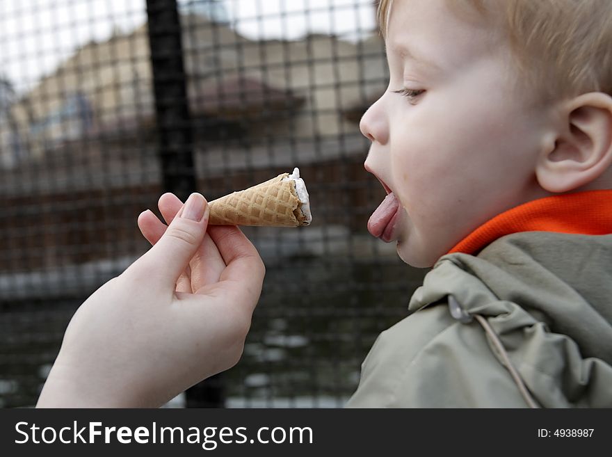 The child and the ice cream outdoor. The child and the ice cream outdoor