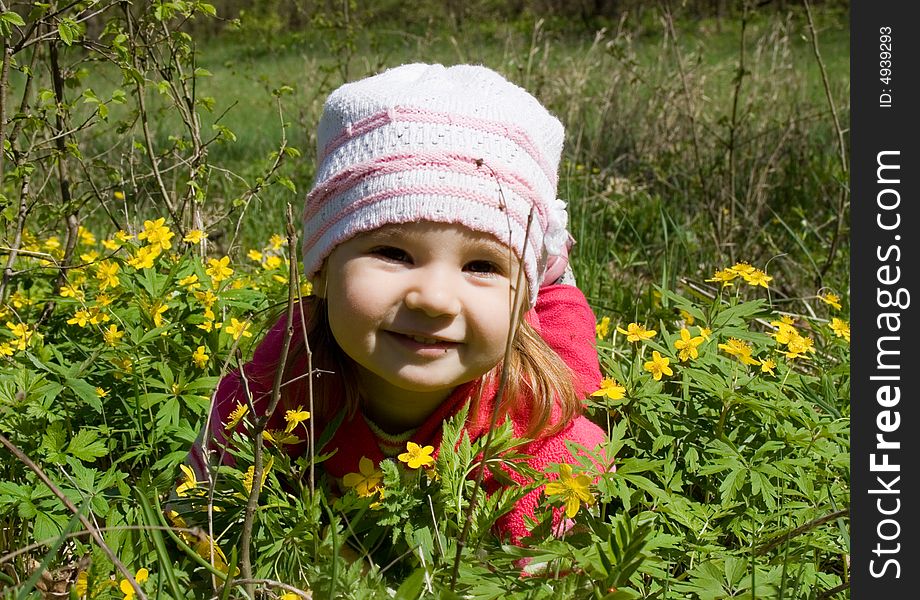 Child In Flowers