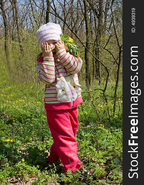 Little girl hiding in the forest. Little girl hiding in the forest