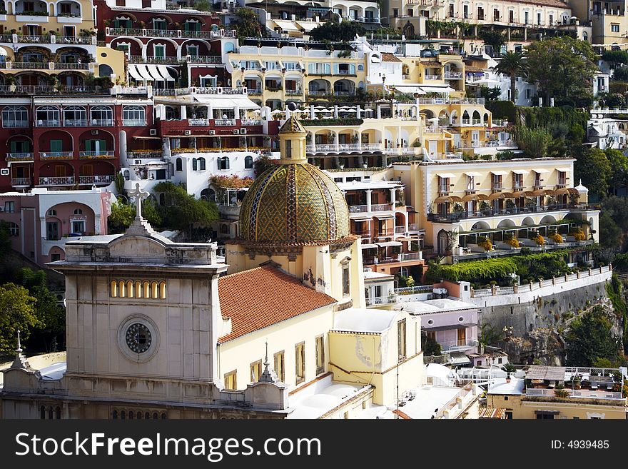 Mediterranean sun shines on the old buildings of Positano in Italy. The photo evokes a sense of past and travel. Mediterranean sun shines on the old buildings of Positano in Italy. The photo evokes a sense of past and travel