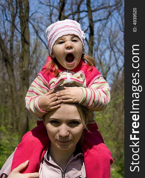 Smiling girl with her mother. Smiling girl with her mother