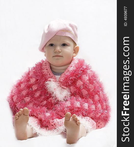Baby In A Pink Poncho And Beret