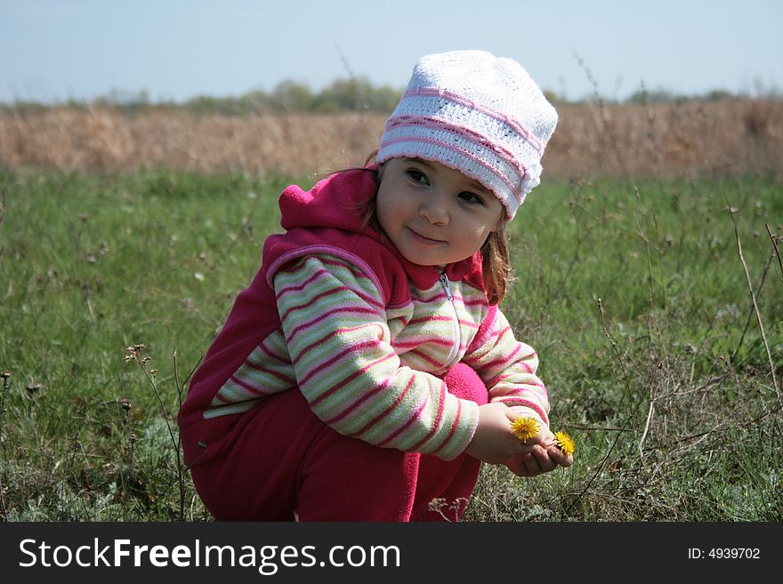 Little girl playing on the meadow. Little girl playing on the meadow