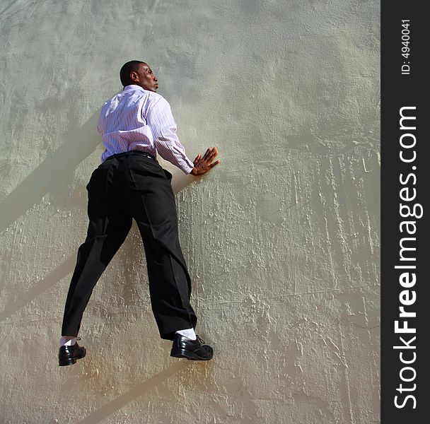 Man who appears to be stuck to the wall. Man who appears to be stuck to the wall.