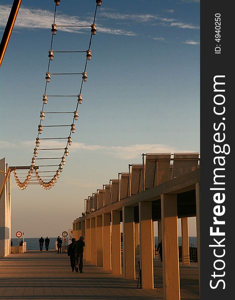 Promenade on the dock at the sunset