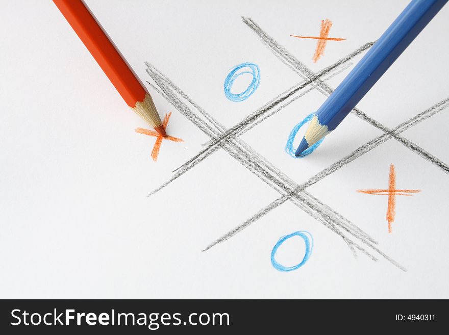 Red and blue pencils standing on white background with pictured ouths and crosses