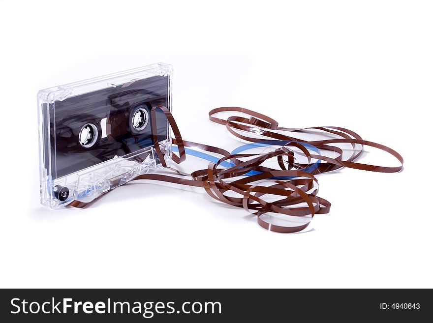 A consept of a old casset tape isolated on a white background. A consept of a old casset tape isolated on a white background.