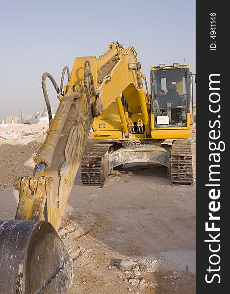 An industrial machine used for digging trenches or doing excavations for construction or laying of pipes. An industrial machine used for digging trenches or doing excavations for construction or laying of pipes.