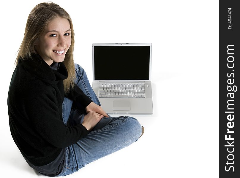 Smiling young woman in front of laptop. Smiling young woman in front of laptop.