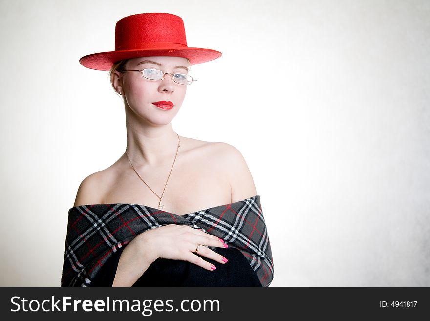 Portrait of aristocratic looking young  sexy woman in red hat and shawl. Portrait of aristocratic looking young  sexy woman in red hat and shawl