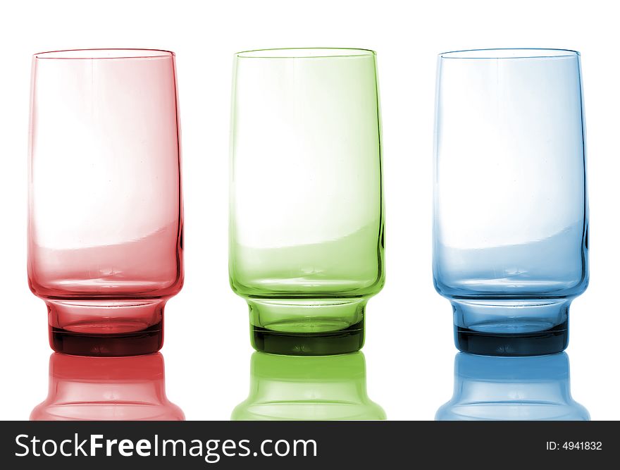 Red, green and blue glass isolated over white background, with reflection. Red, green and blue glass isolated over white background, with reflection