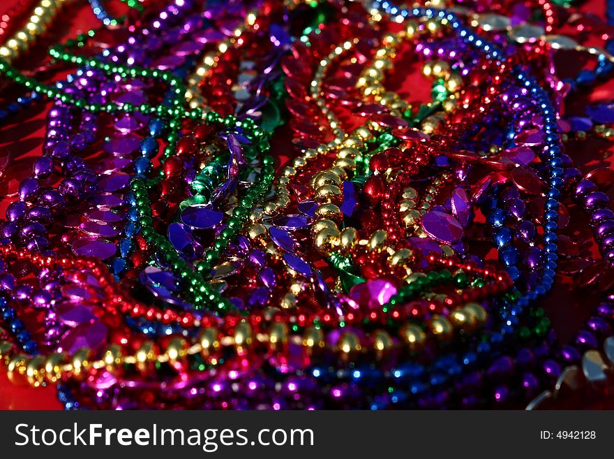A background image of strings of colorful beads.