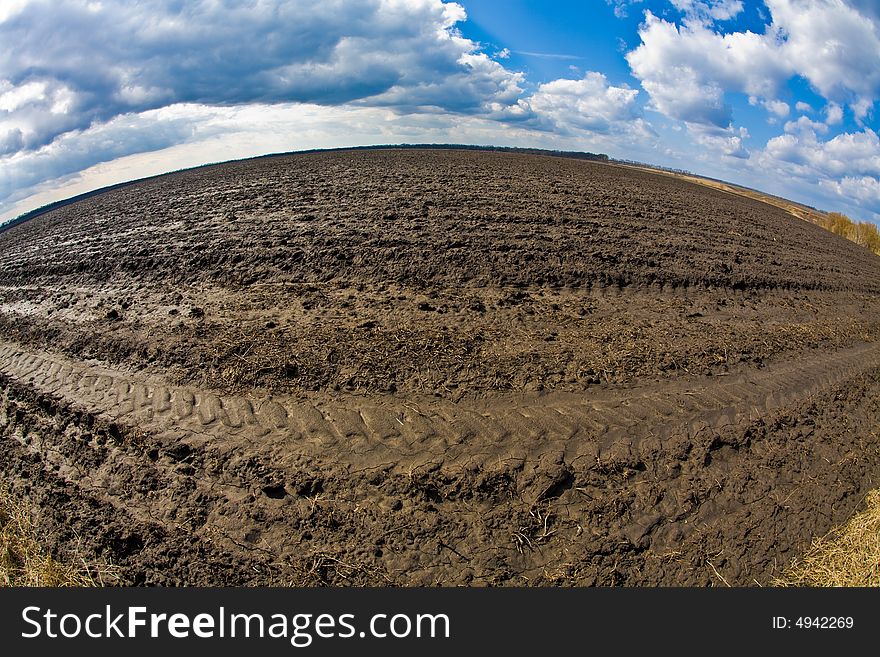 Agriculture theme: fish eye view of plough land