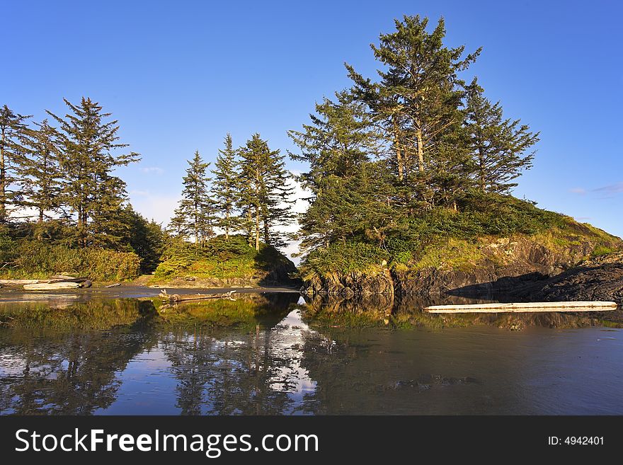 Small picturesque islands on an colossal sandy beach of Pacific coast of Canada. Small picturesque islands on an colossal sandy beach of Pacific coast of Canada