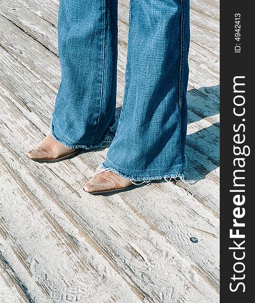 Actually cowgirl, but cowboy boots walking the boardwalk. Actually cowgirl, but cowboy boots walking the boardwalk.