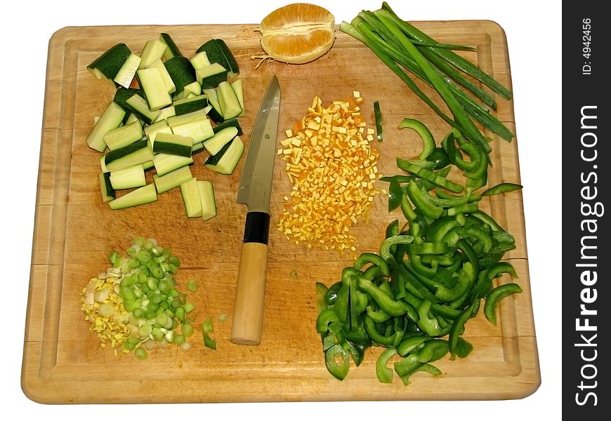 A cutting board with ingredients for preparing Asian style cuisine. A cutting board with ingredients for preparing Asian style cuisine.