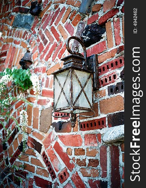 Old style lamp hanging on a brick wall. Old style lamp hanging on a brick wall