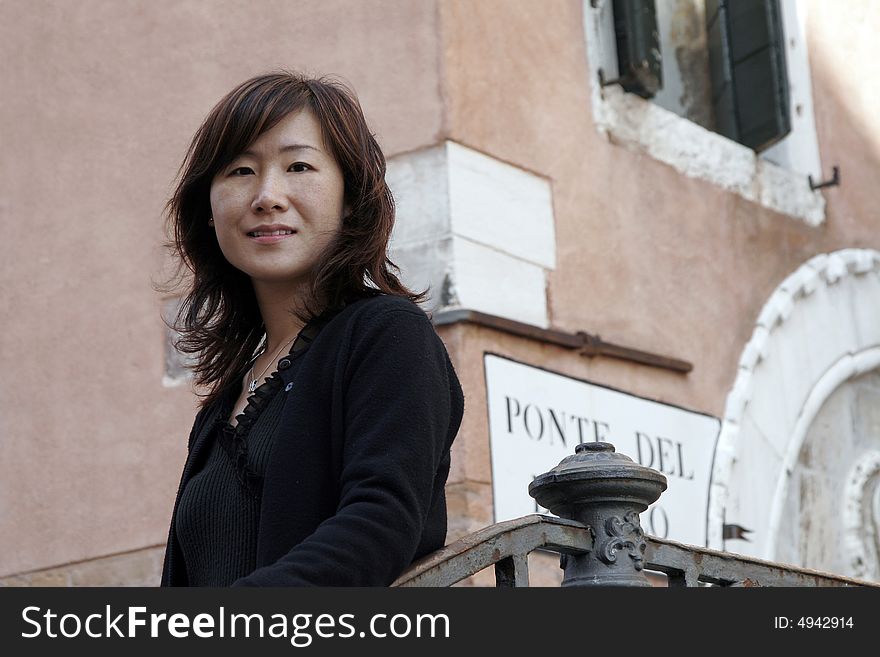 Young Beautiful Asian Girl With Long Black Hair In Venice, Italy. Young Beautiful Asian Girl With Long Black Hair In Venice, Italy