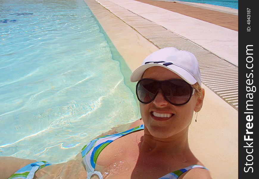 Blue pool water with a happy woman. Blue pool water with a happy woman