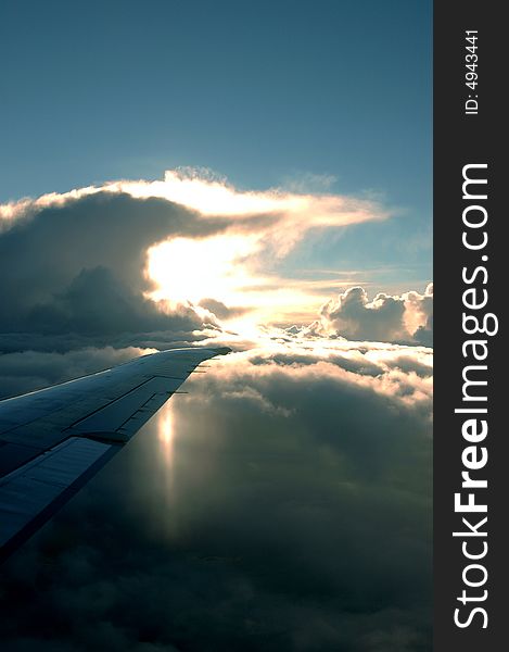 The sun behind clouds from a plane. The sun behind clouds from a plane