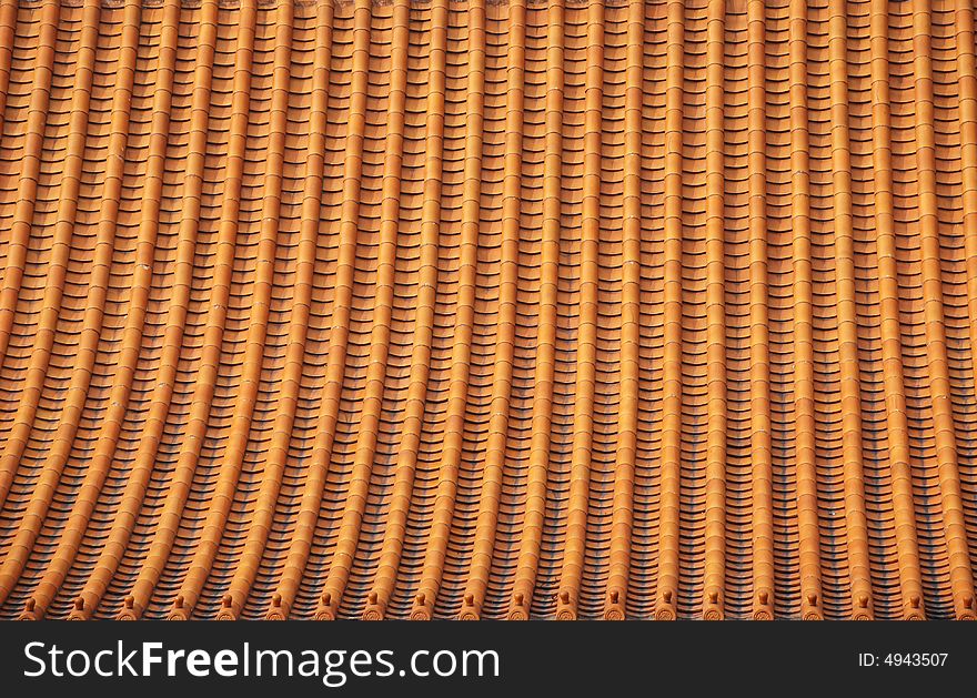 Files of yellow ceramic tiles on a chinese imperial Palaceã€‚. Files of yellow ceramic tiles on a chinese imperial Palaceã€‚