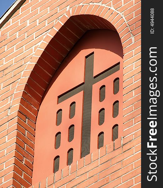 Church Cross in red brick Window Arch. Church Cross in red brick Window Arch