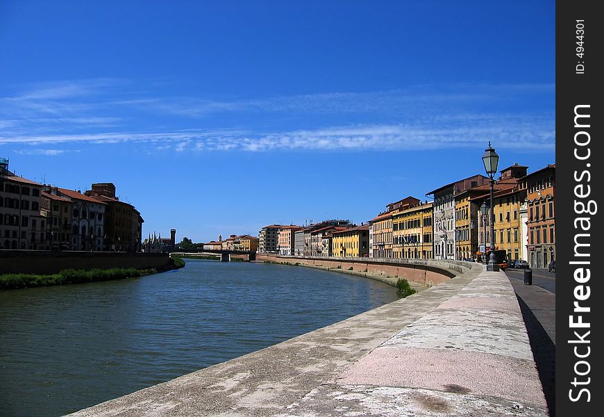 The Riverwalk (Lungarno) along the Arno River in Pisa Italy. The Riverwalk (Lungarno) along the Arno River in Pisa Italy