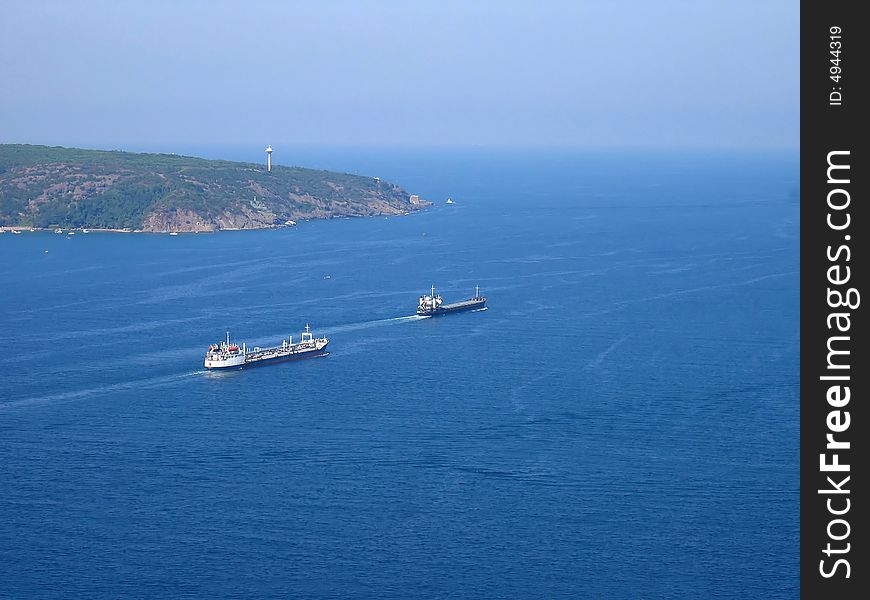 An aerial view of two ships enter the Black Sea from the Bosphorus in Turkey. An aerial view of two ships enter the Black Sea from the Bosphorus in Turkey