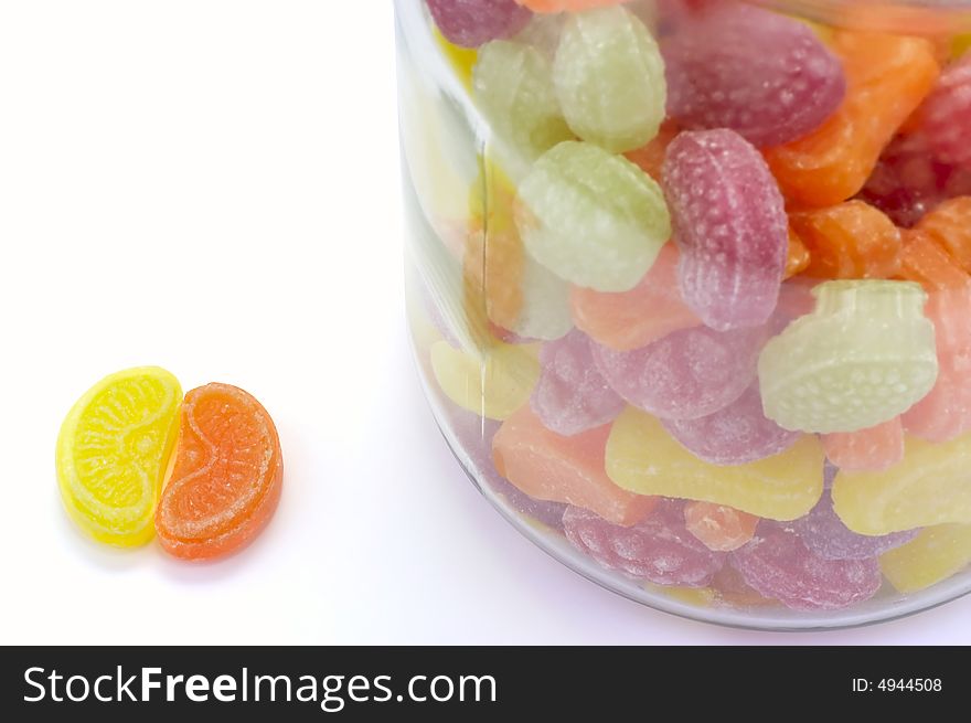 Multicolor bonbons in glass pot