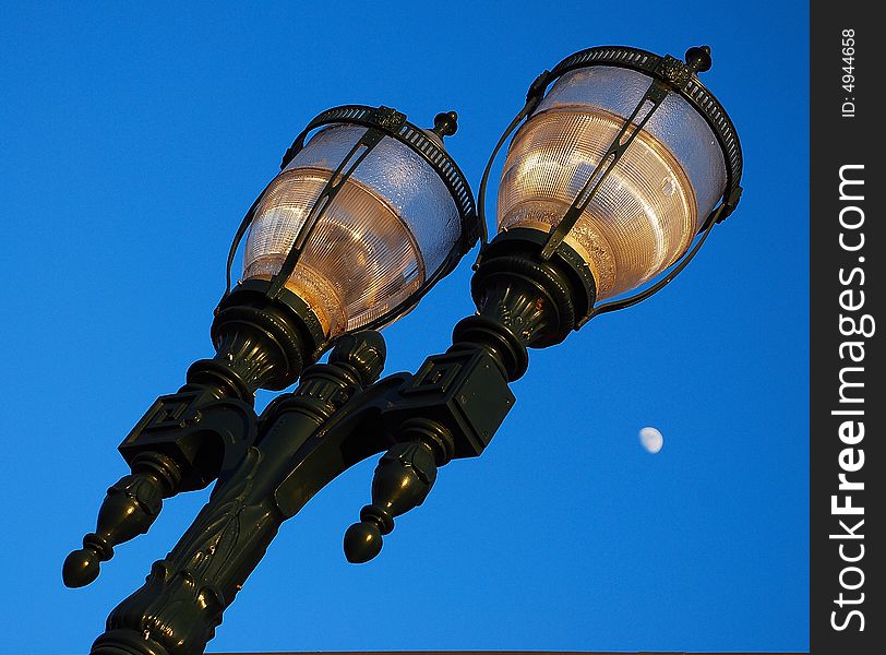 Antique Lampost at Dusk with Moon in the Background