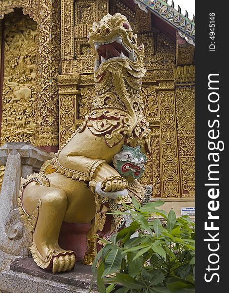 Gold lion statue in a temple of Thailand