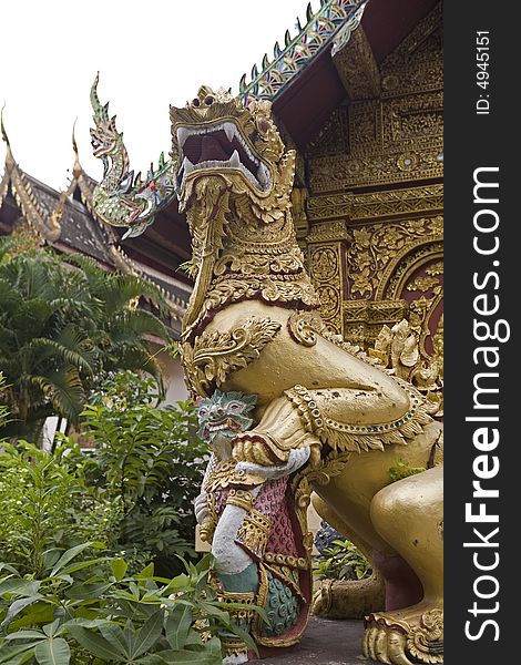 Gold lion statue in a temple of Thailand