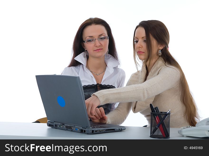 Two business woman work with laptop on white