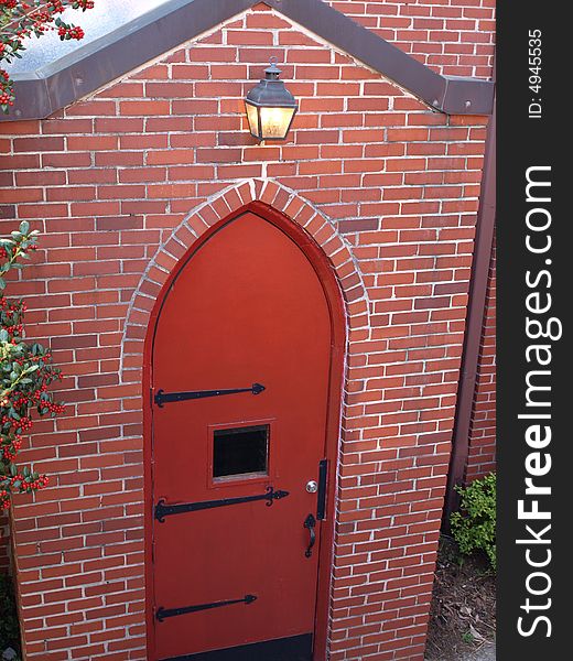 Red Brick Arch Door with light over head. Red Brick Arch Door with light over head