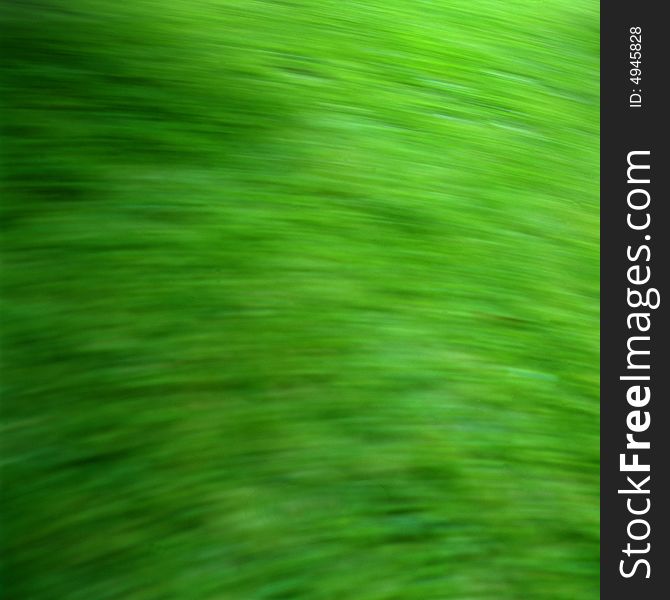 Green grass with motion blur for use as a background