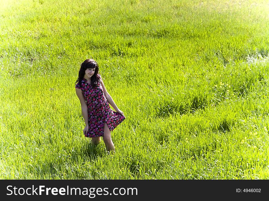 Cheerful young woman surrounded by nature. Cheerful young woman surrounded by nature.