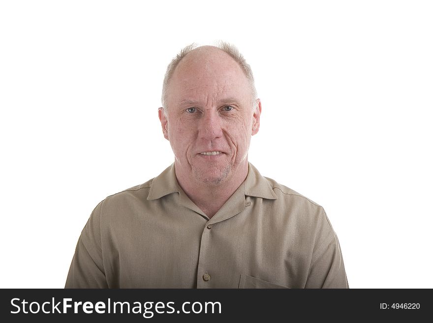 An older guy in a brown shirt on a white background looking into camera. An older guy in a brown shirt on a white background looking into camera