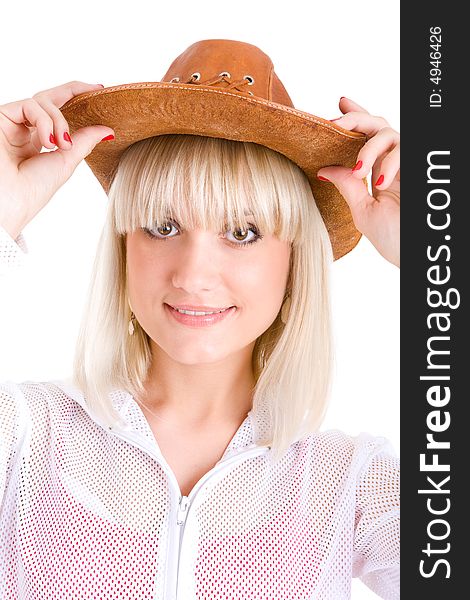 Blond girl puts on a cowboy hat. Blond girl puts on a cowboy hat